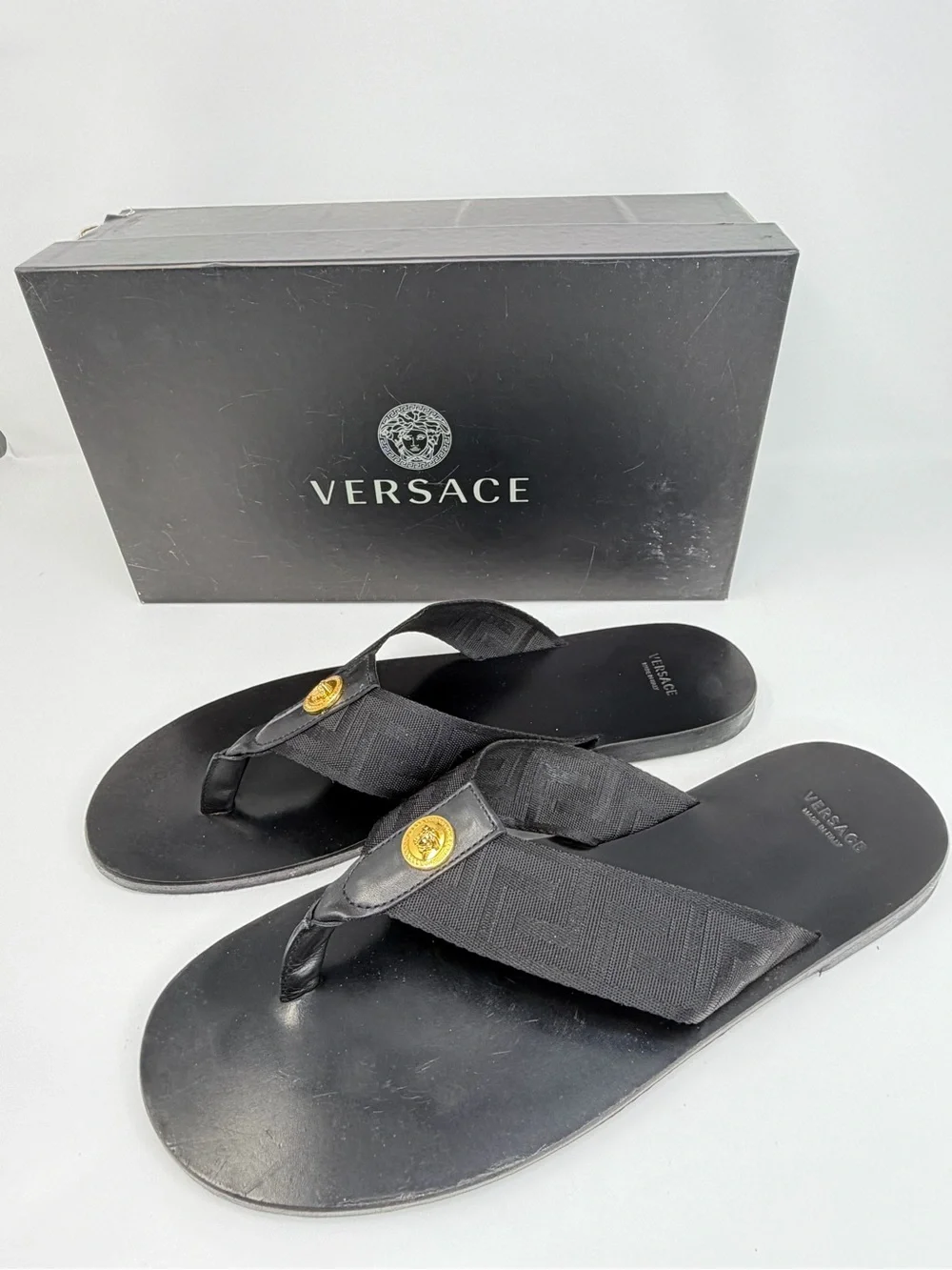Versace Black Thong Sandals with Gold Medusa Accent